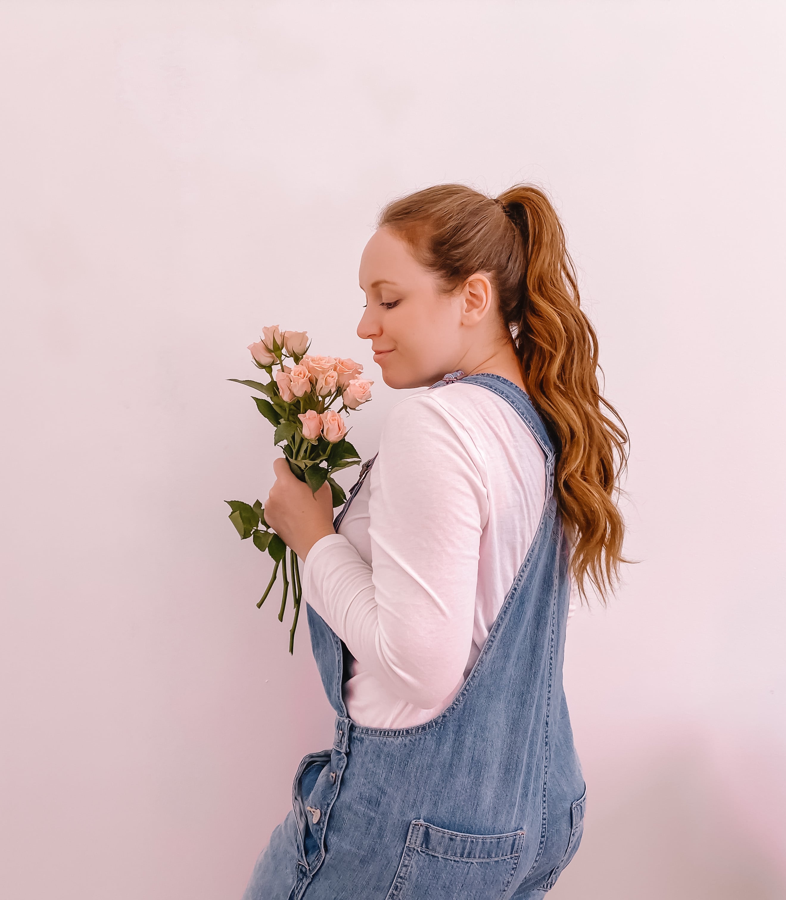 Me standing holding flowers